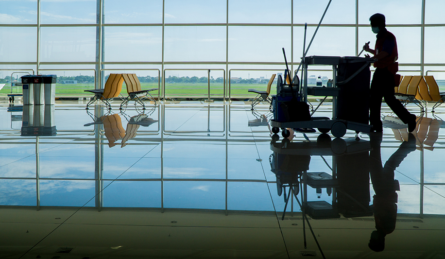 Man cleaning airport with Thymox botanical disinfectant